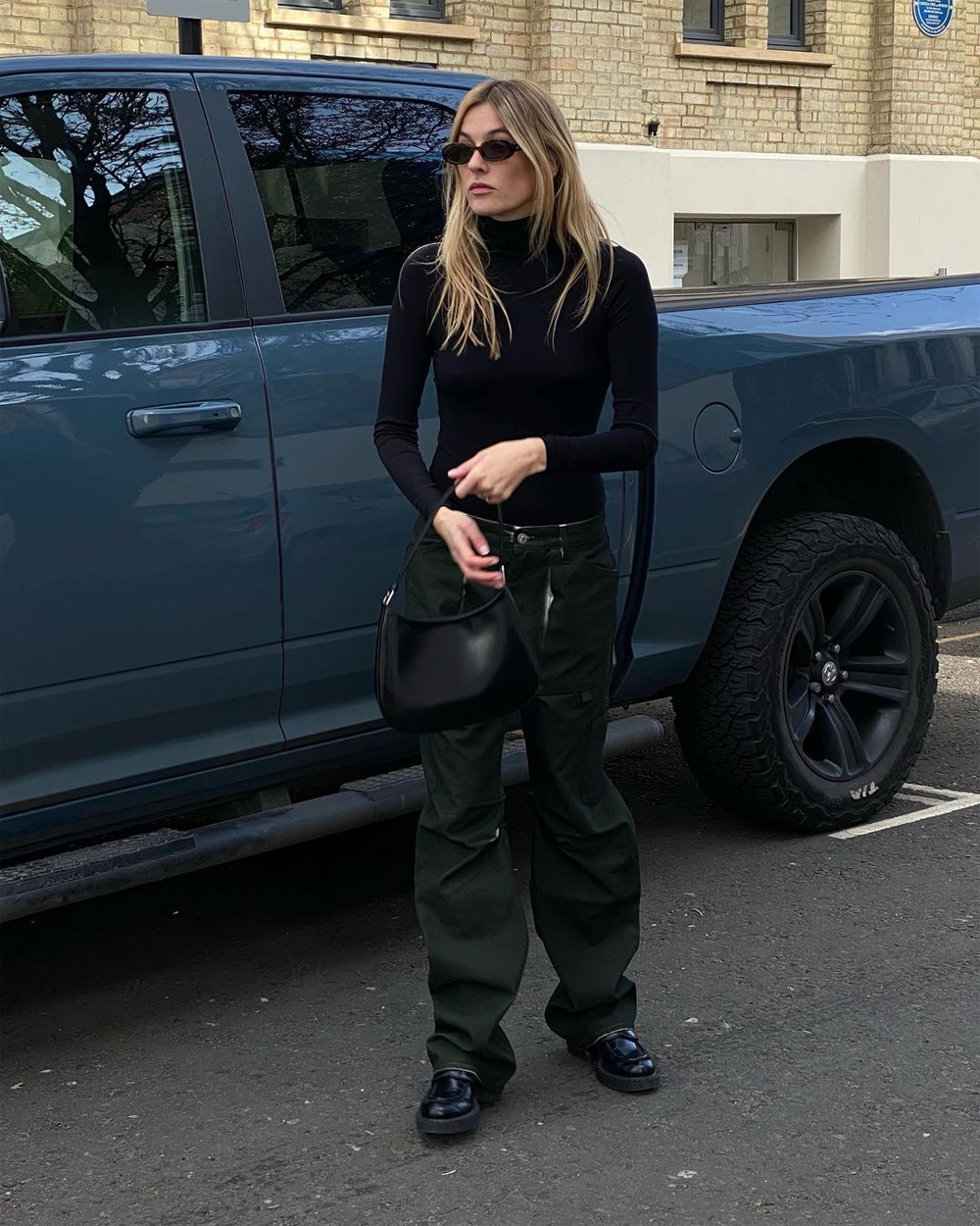 Camille Charriere in an all-black outfit in London | About Her