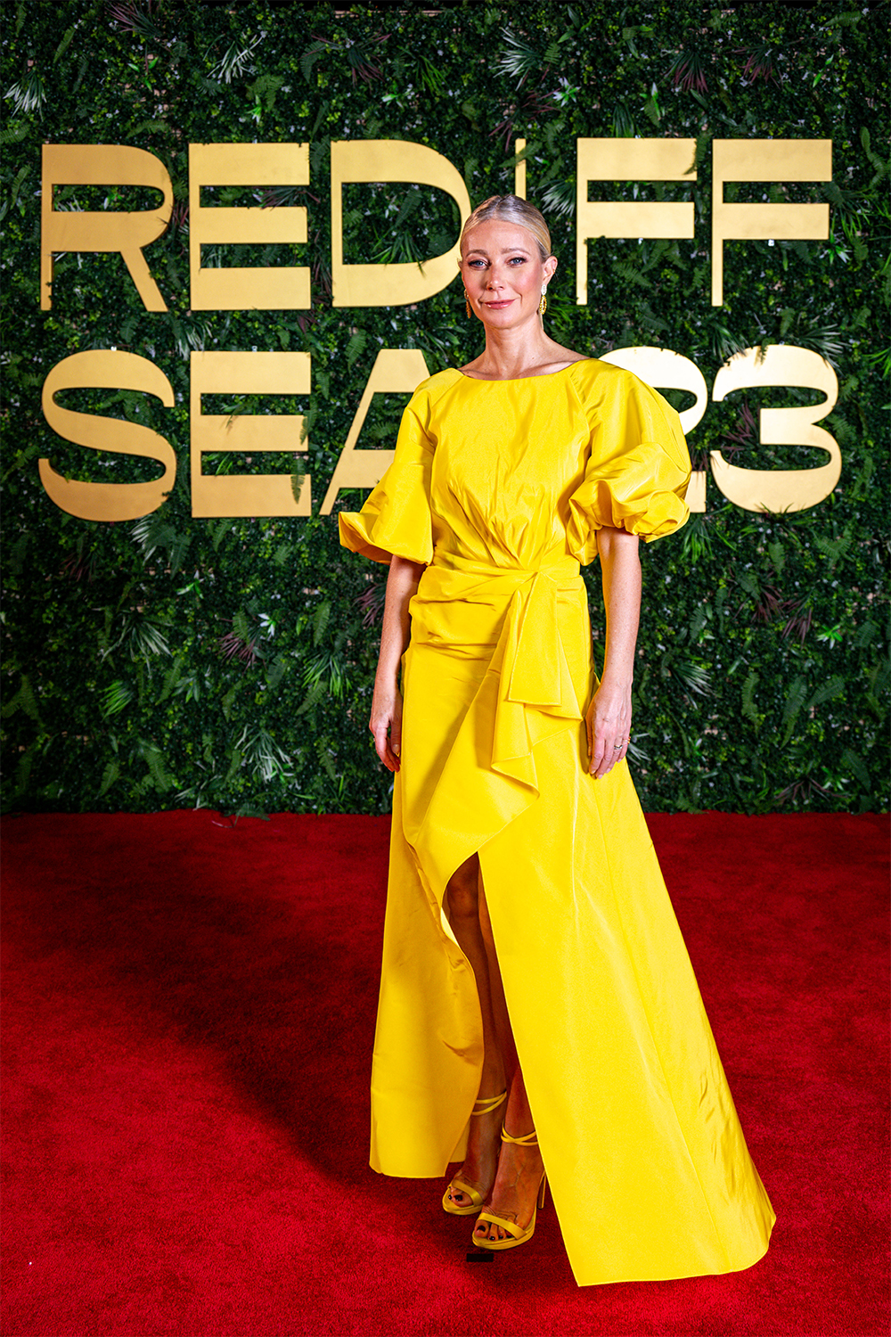 Gwyneth Paltrow wore a yellow shirred puff sleeve sarong gown from the  Resort 2024 collection.